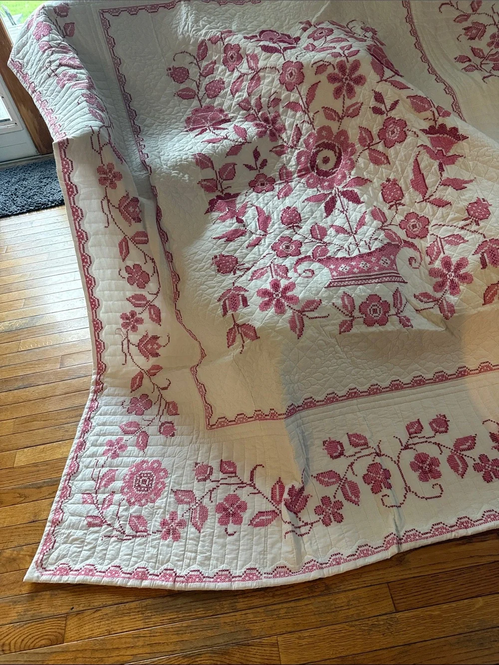 White Quilt with Pink Floral Basket Motif